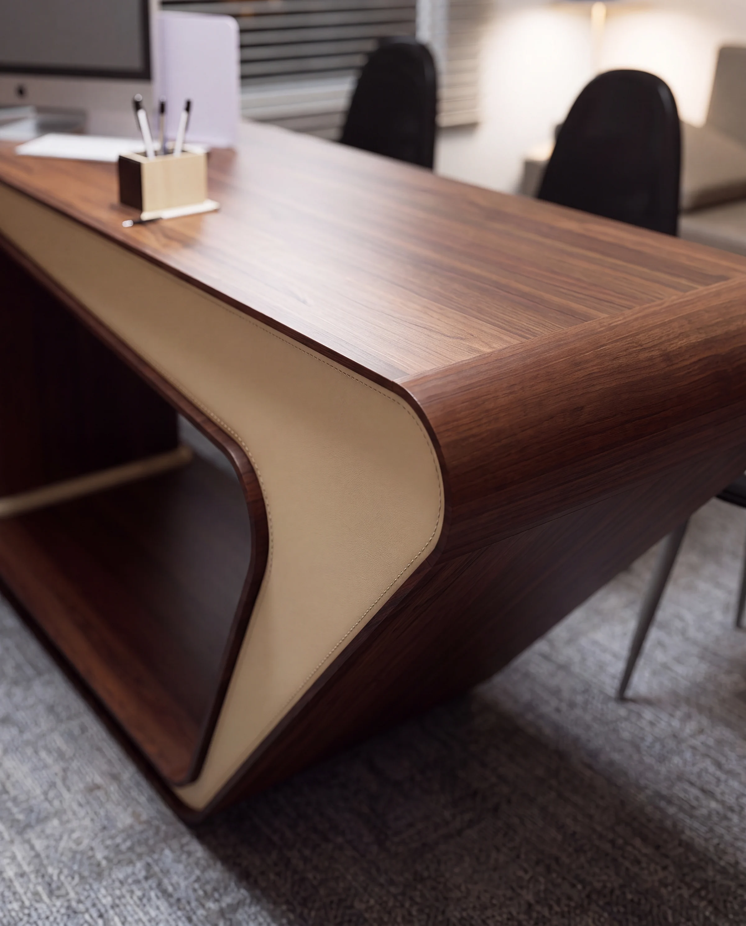 Curved end of the walnut desk
