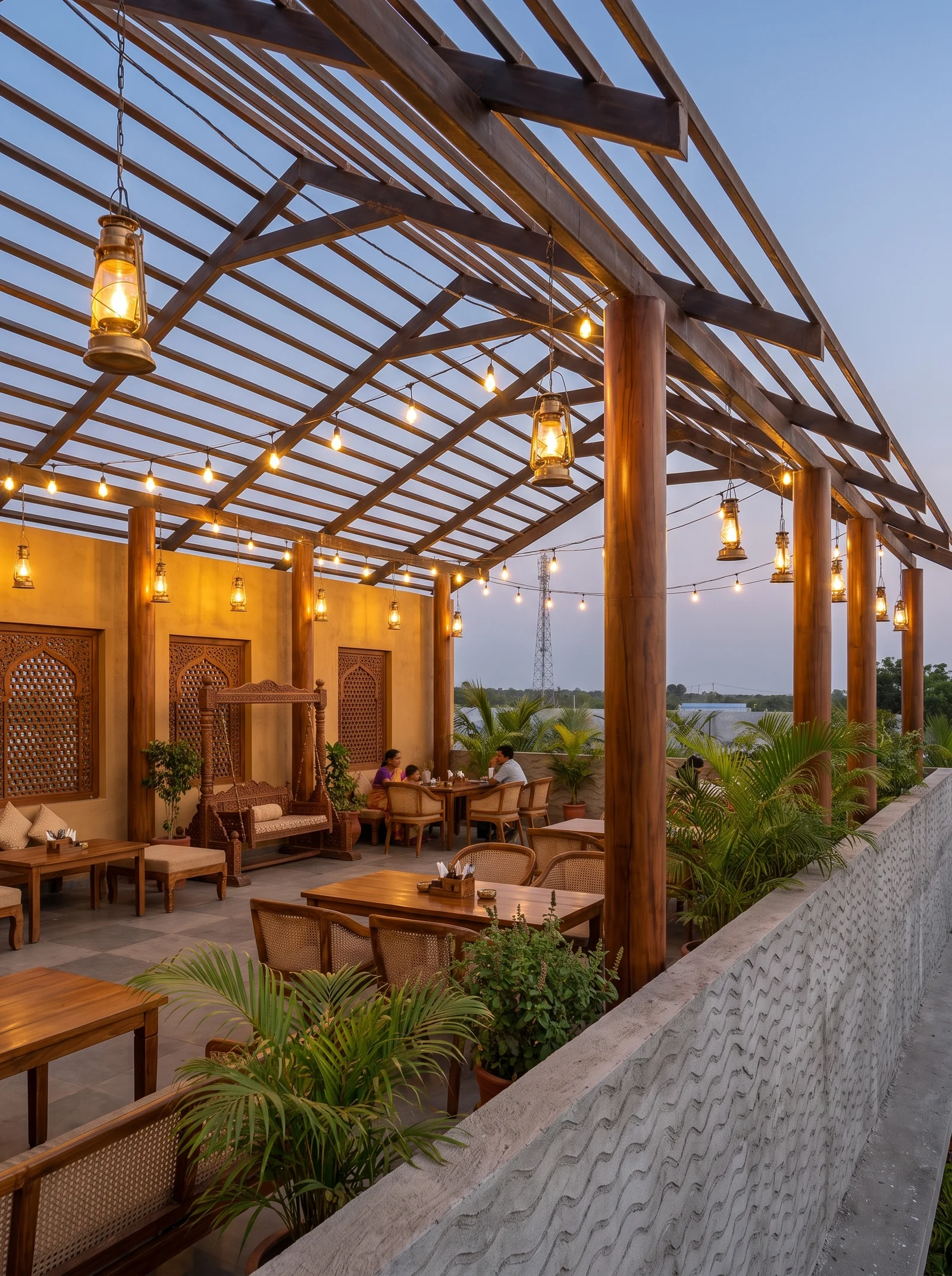 Covered verandah with timber rafters, lanterns and planting at dusk